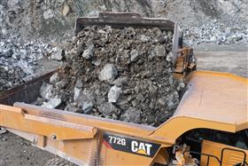 Penn/MD Quarry: A close up shot of the shot rock being loaded into a Caterpillar 772G.