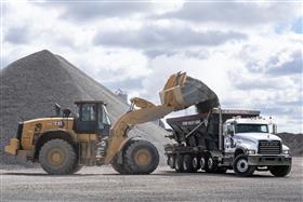 Dagsboro Stone Depot: A Caterpillar 982M loads a customer truck with aggregate at Dagsboro Stone Depot.