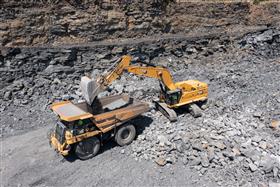 Pottsville Quarry & Asphalt: A Caterpillar 395 loads a 777F with shot rock in the pit.