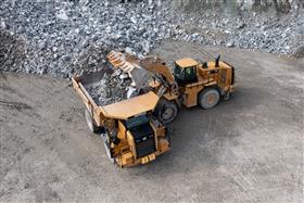 Penn/MD Quarry: A Caterpillar 772G gets loaded with shot rock by a 988K loader. 