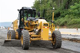 Lehigh Valley Division: A Caterpillar 12M3 motor grader grades aggregate in preparation for a new roadway to be paved.