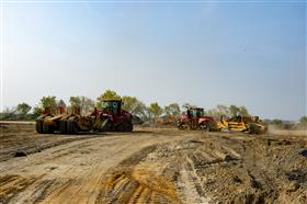 Haines & Kibblehouse, Inc.: Two scraper tractors work on the Southport Project.