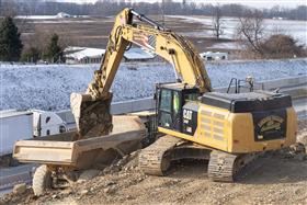 Lehigh Valley Division: A Caterpillar 349F loads a Komatsu articulated dump truck with material along I78. 