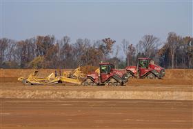 Pottstown Division: Two Case IH 580 tractors strip top soil. 
