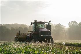 Landis C. Deck & Sons Division: A Case IH 540 QuadTrac pulls a K-Tec 1228 Scraper.