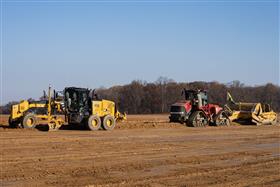 Pottstown Division: A Caterpillar 12M3 works with a Case IH 540 and KTec 1228 combo to strip material off a pad.