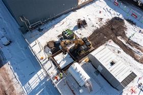 Haines & Kibblehouse, Inc.: A crew prepares to set a precast structure in place.