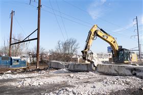 Haines & Kibblehouse, Inc.: A Caterpillar 336F processes concrete beams on I-95.