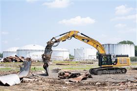 Haines & Kibblehouse, Inc.: A Caterpillar 349F utilizes a shear to process metal on a tank farm demolitions site. 
