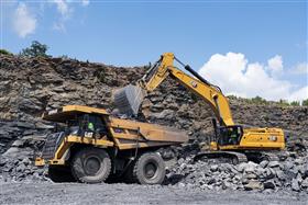 Pottsville Quarry & Asphalt: A Caterpillar 395 loads a Caterpillar 777F with shot rock.