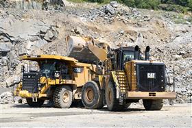 Douglassville Quarry: A Caterpillar 990K loads a 775G with shot rock.