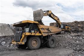 Pottsville Quarry & Asphalt: A Caterpillar 777F is loaded with shot rock by a Caterpillar 390D.