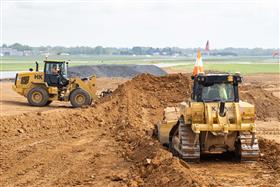 Lehigh Valley Division: A Caterpillar D6 feeds stripped soil to a Caterpillar 938M loader