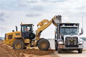 Lehigh Valley Division: A Caterpillar 938M loads a Mack Granite dump truck with export material. 