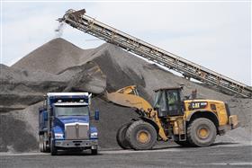 Pottsville Quarry & Asphalt: A Caterpillar 982M loads a Kenworth dump truck with aggregate. 