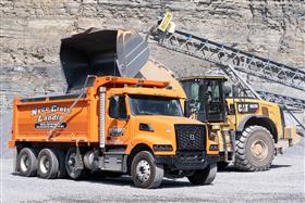Naceville Quarry: A Caterpillar 982M loads a dump truck with aggregate product.