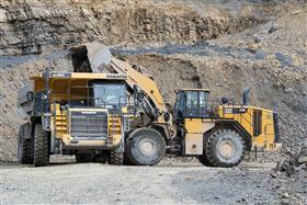 Naceville Quarry: A Komatsu HD465 is loaded with shot rock by a Caterpillar 988K.