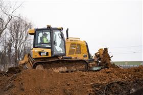 Pottstown Division: A Caterpillar D5K2 pushes soil up a stock pile. 