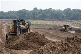 Haines & Kibblehouse, Inc.: Two Caterpillar D6TXW LGP dozers work in a pond.