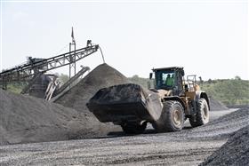Naceville Quarry: A Caterpillar 982M moves aggregate product to stockpiles. 