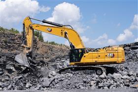 Pottsville Quarry & Asphalt: A Caterpillar 395 works with shot rock in the pit. 