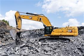 Pottsville Quarry & Asphalt: A Caterpillar 395 works with shot rock in the pit. 