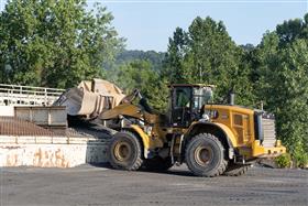 Warren Asphalt: A Caterpillar 966M loads a hopper with aggregate. 