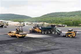 Harrisburg Division: Paving the Muir Army Airfield. The attached image does not imply DoD endorsement of or express a DoD opinion about a product, service, company or organization, or objective.