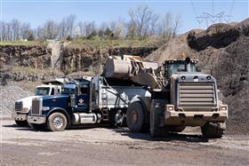 Chalfont Quarry & Asphalt: A Caterpillar 980M loads a dump truck with aggregate.