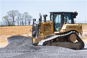 Landis C. Deck & Sons Division: A Caterpillar D6 grades stone on a building pad. 