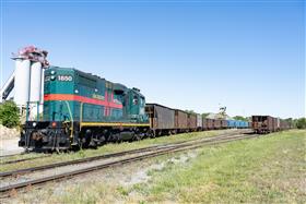 Dagsboro Stone Depot: Dagsboro Stone Depot's unloading crew utilizes their EMD GP11 locomotive to spot cars over the unloading hopper. 