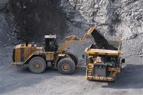 Easton Quarry: A Caterpillar 990K loads a Caterpillar 775G with shot rock.