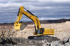 Pottsville Quarry & Asphalt: A Caterpillar 395 waits to load a truck with shot rock. 