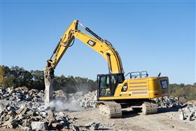 Hawley Quarry: A Caterpillar 336 hammers rock.