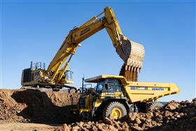 Landis C. Deck & Sons Division: A Komatsu PC1250 and HD605 rigid frame truck move material on a mass excavation site. 