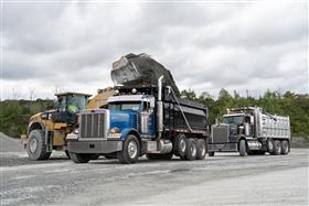 Hilltop Quarry: A Caterpillar 980K loads a dump truck with aggregate.