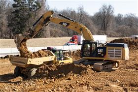 Pottstown Division: A Caterpillar 349F loads a Caterpillar 730 rock truck with export material.