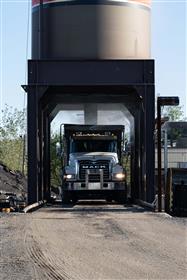 Delaware Valley Asphalt: A truck is loaded with asphalt from the silo. 