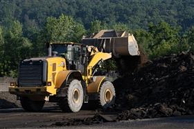 Warren Asphalt: A Caterpillar 966M stockpiles recycled asphalt material. 