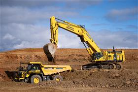 Landis C. Deck & Sons Division: A Komatsu HD605 gets loaded with material by a PC1250 on a mass excavation site. 