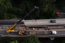 Structures Division: A Structures Division crew removes bridge beams during a demolition project. 