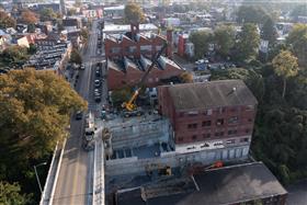 Structures Division: A Structures Division crew installs precast concrete wall sections.