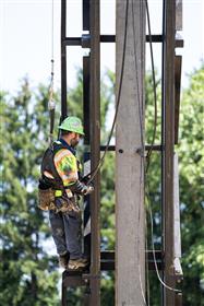 Structures Division: A Structures Division team member prepares a beam for installation with a hammer. 