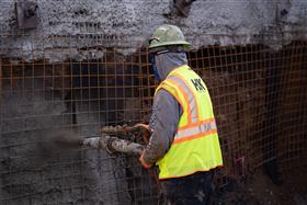 Structures Division: A Structures Division team member sprays shotcrete. 