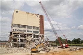 Haines & Kibblehouse, Inc.: While a crane works on the demolition of the main structure with a wrecking ball, a Caterpillar 336F processes larger material into more manageable pieces.