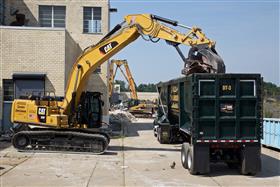 Haines & Kibblehouse, Inc.: A Caterpillar 336F loads a demolition trailer with scrap.