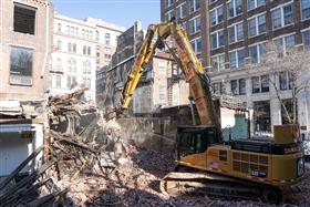 Haines & Kibblehouse, Inc.: A Caterpillar 345C outfitted with demolition gear works along Jeweler's Row in Philadelphia, PA. 