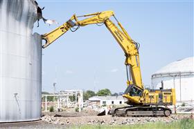Haines & Kibblehouse, Inc.: A Komastu PC1250, equipped with a shear, takes down an old gasoline storage tank at a demolition job in Philadelphia, PA. 