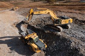 Harrisburg Division: A Komatsu PC800 loads a Komatsu HM400 with rock.