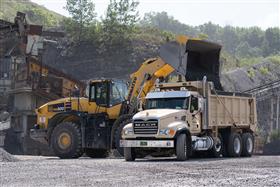Naceville Quarry: A Komatsu WA-500 loads a dump truck with aggregate.